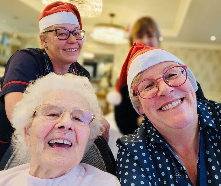 employees and residents from Rawcliffe Manor care home showing happy faces and big smiles as mask-wearing rule is now no longer mandatory